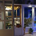 Modern House In Front Of Midnight Sun