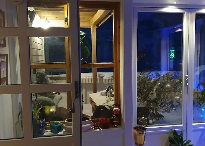 Modern House In Front Of Midnight Sun