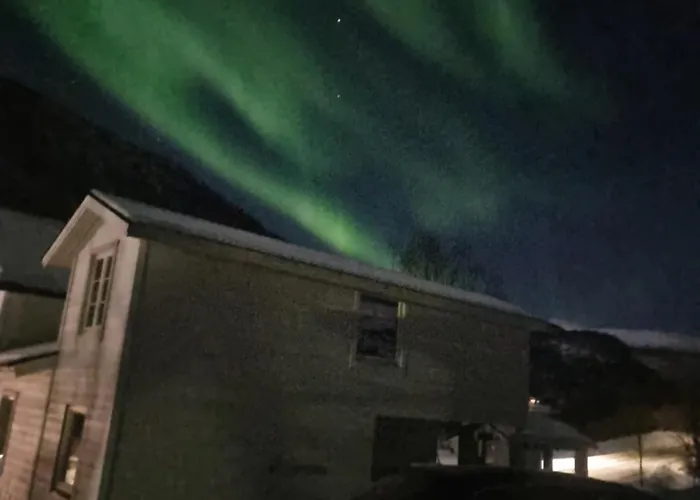 Modern House In Front Of Midnight Sun Lavangen