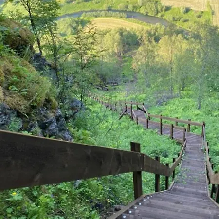 Modern House In Front Of Midnight Sun Lavangen