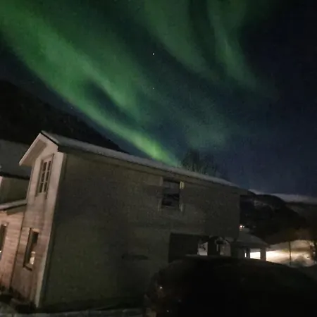 Modern House In Front Of Midnight Sun Lavangen